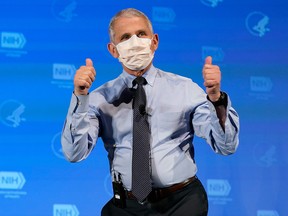 Anthony Fauci, director of the National Institute of Allergy and Infectious Diseases, gestures after receiving his first dose of the Covid-19 vaccine at the National Institutes of Health on December 22, 2020, in Bethesda, Maryland.