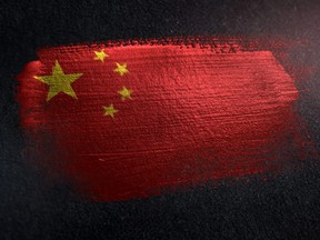 China Flag Made of Metallic Brush Paint on Grunge Dark Wall