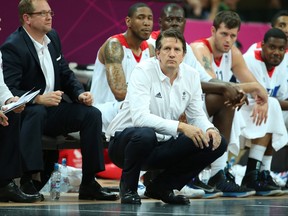 Great Britain coach Chris Finch looks on with Nick Nurse (left) at a men’s basketball preliminary-round match for the London 2012 Olympic Games.