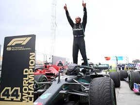 In this file photo taken on November 15, 2020 Mercedes' driver Lewis Hamilton reacts after winning the Turkish Formula One Grand Prix at the Intercity Istanbul Park circuit in Istanbul.