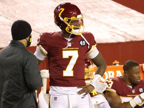 Washington Football Team quarterback Dwayne Haskins (7) stands on the sidelines after being benched against the Carolina Panthers at FedExField.