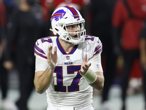 Quarterback Josh Allen of the Buffalo Bills reacts to a first down during the second quarter of a game against the San Francisco 49ers at State Farm Stadium on Dec. 7, 2020 in Glendale, Ariz..