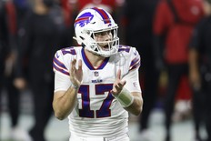Quarterback Josh Allen of the Buffalo Bills reacts to a first down during the second quarter of a game against the San Francisco 49ers at State Farm Stadium on Dec. 7, 2020 in Glendale, Ariz..