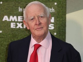 In this file photo taken Oct. 14, 2018, British author John le Carre (David Cornwell) poses upon arrival for the world premiere of the film “The Little Drummer Girl” during the BFI London Film Festival in London.