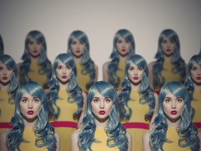 Many Glamour Beauty Woman Clones. Identical Crowd Concept. On Gray Background.