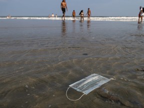 A discarded mask floats in the ocean in New Jersey.