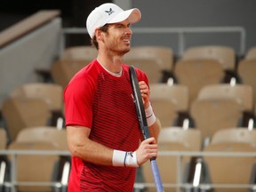 Britain's Andy Murray reacts after losing his first round match against Switzerland's Stan Wawrinka at the French Open in Paris, Sept. 27, 2020.