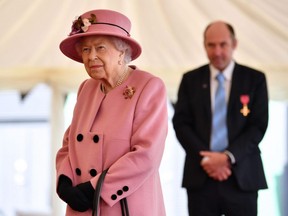 Britain's Queen Elizabeth II during a visit to the Defence Science and Technology Laboratory near Salisbury, southern England, on October 15, 2020.
