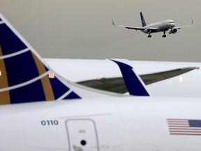 A United Airlines passenger jet lands at Newark Liberty International Airport, New Jersey, December 6, 2019.