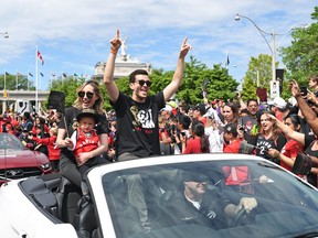 Raptors general manager Bobby Webster with his family at the championship parade. Webster says he doesn't yet know if his family will join him in Tampa Bay.