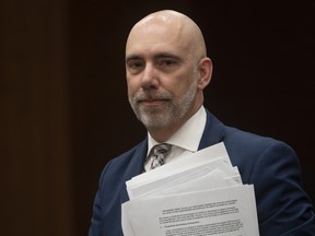 Parliamentary Budget Officer Yves Giroux waits to appear before the Commons finance committee on Parliament Hill in Ottawa, Tuesday, March 10, 2020.