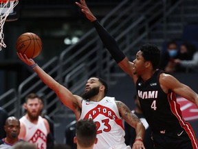 Toronto Raptors guard Fred VanVleet makes a basket over Miami Heat forward KZ Okpala during the second quarter at Amalie Arena.