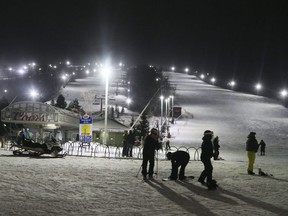 People enjoy night skiing at Blue Mountain ski resort, west of Collingwood, Ont., Jan. 29, 2019.