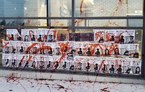 Anti-police protesters demonstrated outside Peel Regional Police Service’s 11 Division in Mississauga on Friday, Dec. 11, 2020. The police station was also splattered with red paint.