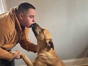 Dylan Abbs is reunited with his dog, Nitro.