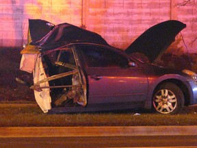 A car is sheared in half following a single-vehicle crash on Martin Grove Rd. in Toronto on Dec. 10, 2020.