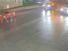 Toronto Police have released footage of a shooting in May involving two tow trucks. They are looking for a male suspect in connection with the incident.