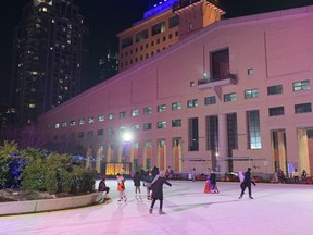 People skate in Celebration Square at Mississauga City Hall in December 2020.
