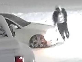 CCTV image of a suspect behind a tow truck fire Dec. 9 in Newmarket.