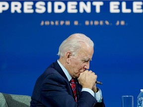 U.S. President-elect Joe Biden listens as he holds a videoconference meeting with members of the U.S Conference of Mayors at his transition headquarters in Wilmington, Delaware, U.S., November 23, 2020.