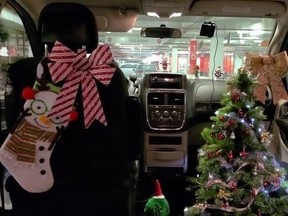 Forest Atkinson, 31, has been driving an Uber for the past month, decorated in Christmas garb to lift spirits of her passengers.
