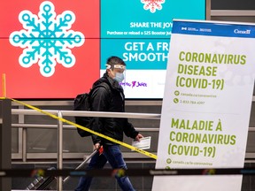A man walks through Terminal 3 at Pearson airport in Toronto December 30, 2020.