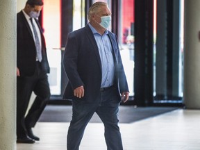 Premier Doug Ford leaves the Metro Toronto Convention Centre on Jan. 17, 2021