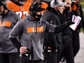 Head coach Zac Taylor of the Cincinnati Bengals calls tactics to players during the fourth quarter against the Pittsburgh Steelers at Paul Brown Stadium on December 21, 2020 in Cincinnati, Ohio.