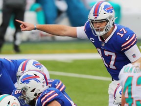 Josh Allen #17 of the Buffalo Bills calls a play in the second quarter against the Miami Dolphins at Bills Stadium on January 3, 2021 in Orchard Park, New York.