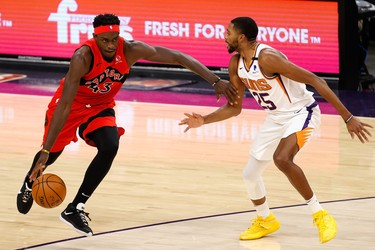 PHOENIX, ARIZONA - JANUARY 06: Pascal Siakam #43 of the Toronto Raptors drives the ball against Mikal Bridges #25 of the Phoenix Suns during the first half of the NBA game at Phoenix Suns Arena on January 06, 2021 in Phoenix, Arizona. NOTE TO USER: User expressly acknowledges and agrees that, by downloading and or using this photograph, User is consenting to the terms and conditions of the Getty Images License Agreement. (Photo by Christian Petersen/Getty Images)