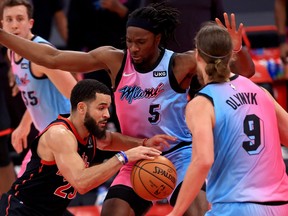 Fred VanVleet of the Toronto Raptors drives on Precious Achiuwa of the Miami Heat during a game  at Amalie Arena on Wednesday.