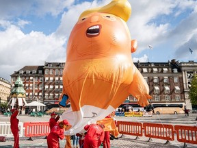 Demonstrators inflate the Baby Trump blimp in Copenhagen, Denmark, on Sept. 2, 2019.