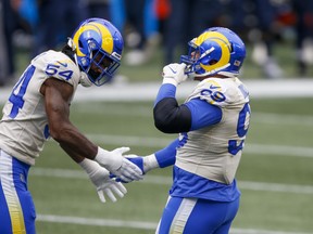 Los Angeles Rams defensive end Aaron Donald (right) celebrates with outside linebacker Leonard Floyd last week.