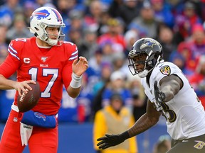 Baltimore Ravens defensive end Jihad Ward pressures Buffalo Bills quarterback Josh Allen during a game in 2019.