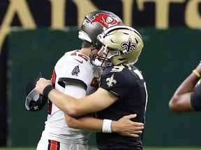 Tampa Bay's Tom Brady (left) hugs Drew Brees of the New Orleans Saints after a game earlier this season.