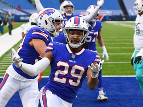 Jan 3, 2021; Orchard Park, New York, USA; Buffalo Bills cornerback Josh Norman (29) gestures after his interception return for a touchdown against the Miami Dolphins during the third quarter at Bills Stadium. Mandatory Credit: Rich Barnes-USA TODAY Sports ORG XMIT: IMAGN-426938
