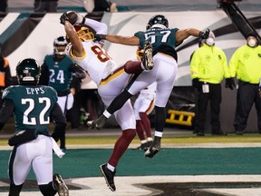 Washington Football Team tight end Logan Thomas (82) makes a touchdown catch past Philadelphia Eagles linebacker T.J. Edwards (57) during the second quarter at Lincoln Financial Field.   Washington won 20-14 to become the final team to qualify for the playoffs.