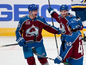 Avalanche left wing Andre Burakovsky (left), celebrating his goal on Friday with  Brandon Saad (20) and defenceman Samuel Girard, spent one game on the top line before being dropped back to the second.