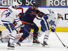 Alex Kerfoot, taking a cross-check from Oilers' Adam Larsson on Thursday night, was assessed three minor penalties in the Leafs' 4-3 win.