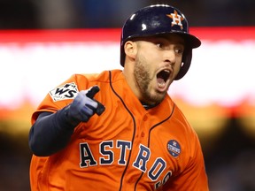 George Springer #4 of the Houston Astros celebrates after hitting a two-run home run during the second inning against the Los Angeles Dodgers in game seven of the 2017 World Series at Dodger Stadium on November 1, 2017 in Los Angeles.