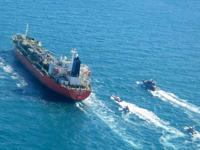 A picture obtained by AFP from the Iranian news agency Tasnim on January 4, 2021, shows the South Korean-flagged tanker being escorted by Iran's Revolutionary Guards navy after being seized in the Gulf.