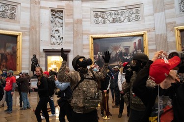 Supporters of US President Donald Trump protest in the US Capitol Rotunda on January 6, 2021, in Washington, DC.  (Photo by SAUL LOEB/AFP via Getty Images)