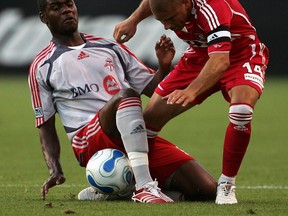 Chris Armas (right) in his playing days.