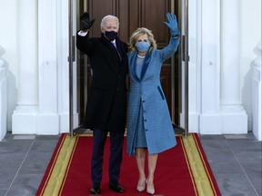 President Joe Biden and first lady Dr. Jill Biden wave as they arrive at the North Portico of the White House, on Jan. 20, 2021, in Washington, D.C.