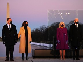 From left to right: Doug Emhoff, Vice-President-elect Kamala Harris, Dr. Jill Biden and President-elect Joe Biden at a memorial for victims of the coronavirus pandemic at the Lincoln Memorial on the eve of the presidential inauguration on Jan. 19, 2021 in Washington, D.C.