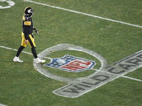 Pittsburgh Steelers quarterback Ben Roethlisberger walks off the field) in the fourth quarter of an AFC Wild Card playoff game at Heinz Field.