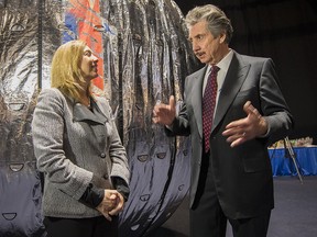 This NASA photo shows NASA Deputy Administrator Lori Garver and President and founder of Bigelow Aerospace Robert T. Bigelow as they talk while standing next to the Bigelow Expandable Activity Module (BEAM) on January 16, 2013 in Las Vegas.