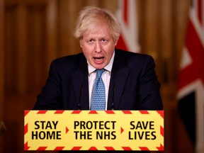 Britain's Prime Minister Boris Johnson speaks during a virtual news conference.