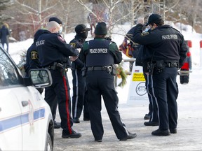 Calgary police and bylaw officers patrolled Bowness Park for crowed control and social distancing in Calgary on Wednesday, Dec. 30, 2020.