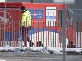 Canada Post employees enter and exit the Gateway East plant in Mississauga at Dixie Rd and Eglinton Ave. E. An employee who tested positive for COVID-19 has died. So far 224 employees have tested positive for COVID since Jan. 1 on Wednesday January 27, 2021.